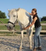 A woman working with a horse.